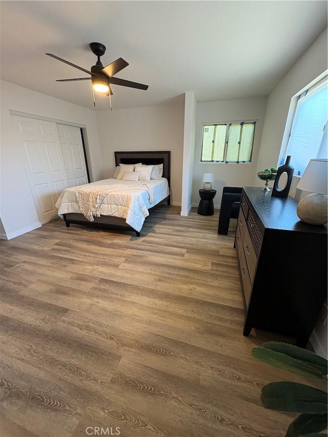 1526 W 54th St, Los Angeles, CA 90062 - bedroom featuring wood finished floors, a closet, and a ceiling fan