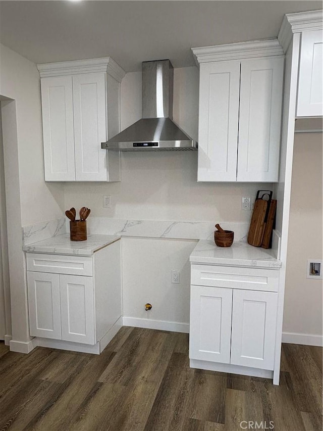 1526 W 54th St, Los Angeles, CA 90062 - kitchen featuring wall chimney exhaust hood, dark wood-style flooring, and white cabinetry