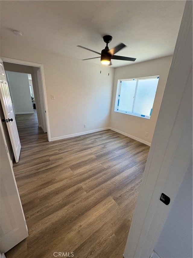 1526 W 54th St, Los Angeles, CA 90062 - spare room featuring wood finished floors and ceiling fan