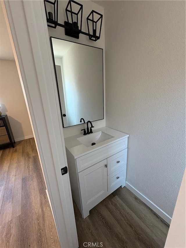 1526 W 54th St, Los Angeles, CA 90062 - bathroom with wood finished floors and vanity