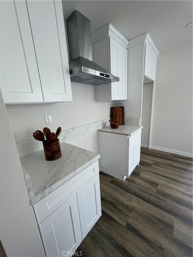 1526 W 54th St, Los Angeles, CA 90062 - kitchen featuring wall chimney exhaust hood, dark wood-type flooring, white cabinets, and light stone countertops
