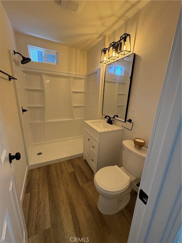 1526 W 54th St, Los Angeles, CA 90062 - bathroom featuring wood finished floors, a shower, and vanity