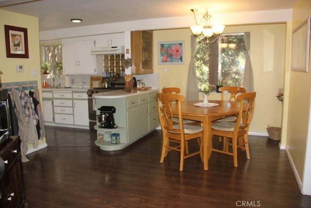 31705 Silver Spruce Dr, Running Springs, CA 92382 - dining space with a chandelier and dark wood-style floors