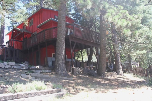 31705 Silver Spruce Dr, Running Springs, CA 92382 - view of front of house featuring a deck, board and batten siding, and stairway