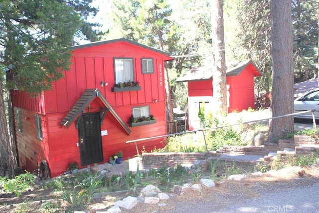 31705 Silver Spruce Dr, Running Springs, CA 92382 - view of front of house with board and batten siding
