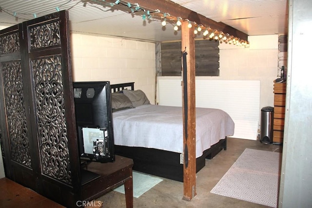 31705 Silver Spruce Dr, Running Springs, CA 92382 - bedroom featuring concrete flooring and concrete block wall