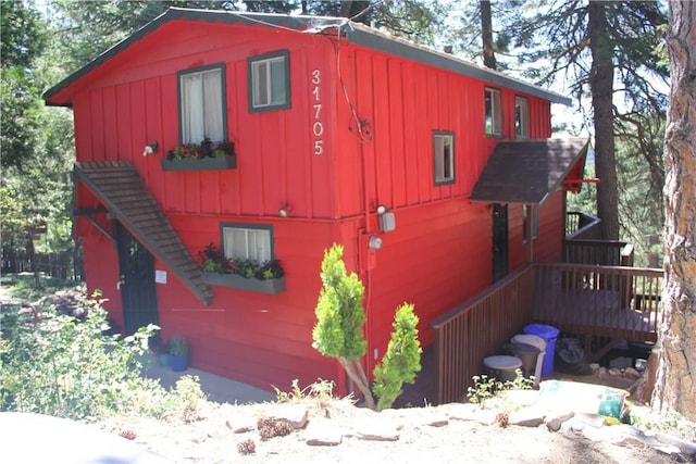 31705 Silver Spruce Dr, Running Springs, CA 92382 - view of property exterior featuring board and batten siding and a deck