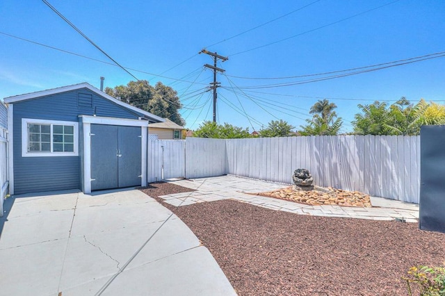 4711 Landis St, San Diego, CA 92105 - fenced backyard featuring a patio and a shed