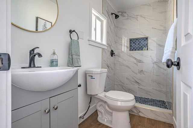 4711 Landis St, San Diego, CA 92105 - full bath with a tile shower, wood finished floors, and vanity