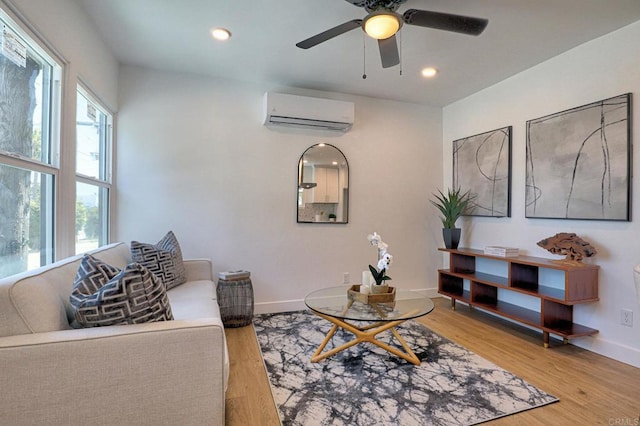 4711 Landis St, San Diego, CA 92105 - living room featuring a wall unit AC, light wood-style flooring, a ceiling fan, and recessed lighting