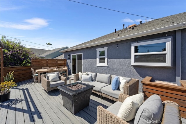 4513 E Cervato St, Long Beach, CA 90815 - wooden terrace featuring an outdoor living space with a fire pit and outdoor dining area