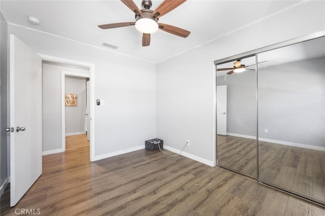 4513 E Cervato St, Long Beach, CA 90815 - unfurnished bedroom with wood finished floors, a closet, and a ceiling fan