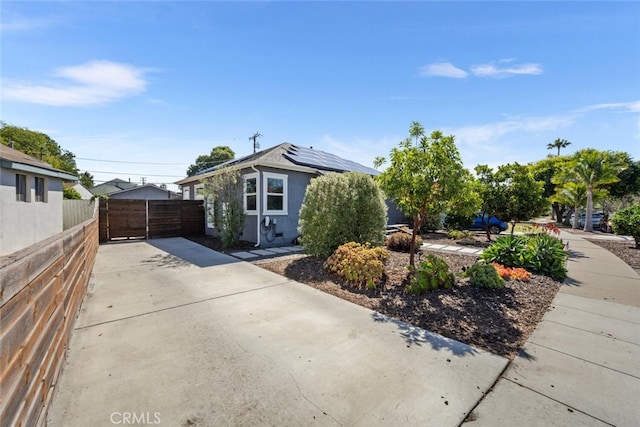 4513 E Cervato St, Long Beach, CA 90815 - view of front of property featuring roof mounted solar panels, concrete driveway, and stucco siding