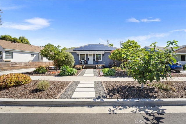 4513 E Cervato St, Long Beach, CA 90815 - view of front of home with solar panels and stucco siding