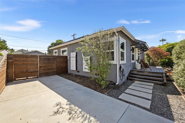4513 E Cervato St, Long Beach, CA 90815 - view of property exterior with stucco siding and a patio