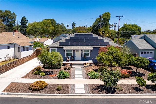 4513 E Cervato St, Long Beach, CA 90815 - ranch-style home featuring roof with shingles, solar panels, and covered porch