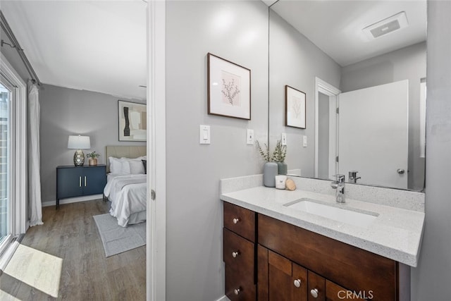 4513 E Cervato St, Long Beach, CA 90815 - ensuite bathroom featuring vanity and wood finished floors