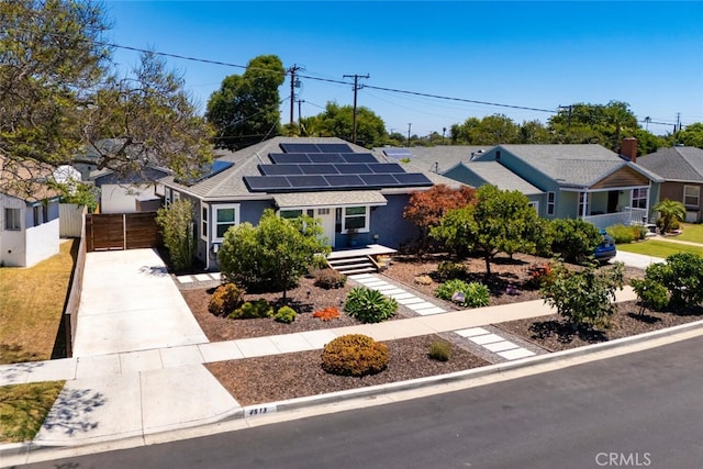 4513 E Cervato St, Long Beach, CA 90815 - ranch-style house featuring solar panels, concrete driveway, roof with shingles, and a garage