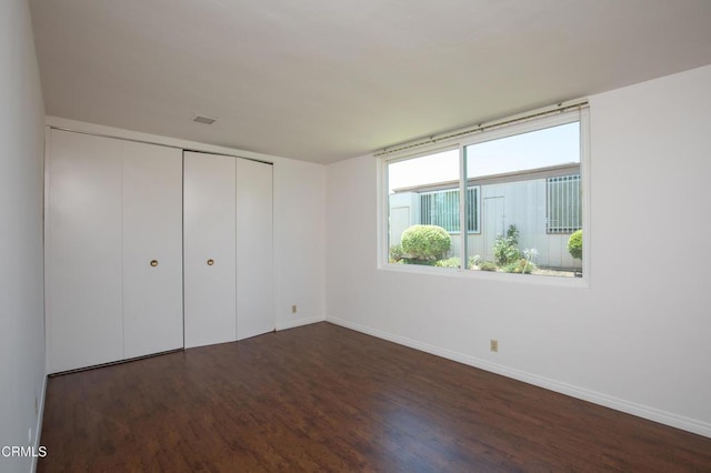 777 E Valley Blvd Unit 142, Alhambra, CA 91801 - unfurnished bedroom with dark wood-style flooring and a closet