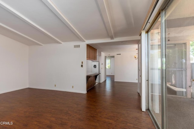 777 E Valley Blvd Unit 142, Alhambra, CA 91801 - unfurnished living room featuring washer / dryer, dark wood-style floors, and beamed ceiling
