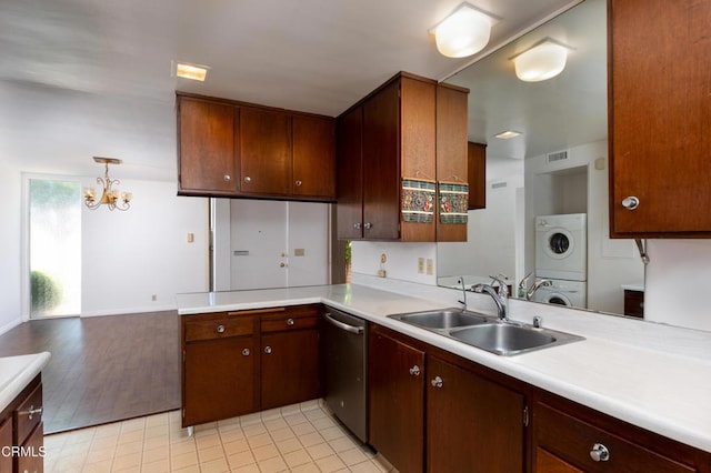 777 E Valley Blvd Unit 142, Alhambra, CA 91801 - kitchen with stacked washer / dryer, stainless steel dishwasher, light countertops, a chandelier, and a peninsula