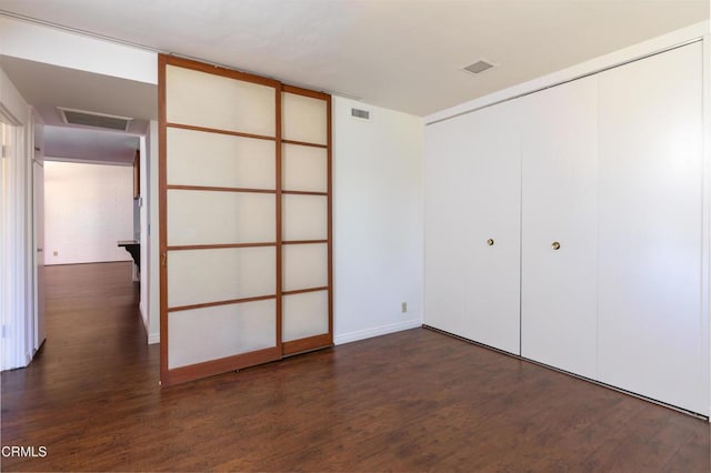 777 E Valley Blvd Unit 142, Alhambra, CA 91801 - unfurnished bedroom with dark wood-type flooring, a closet, and attic access