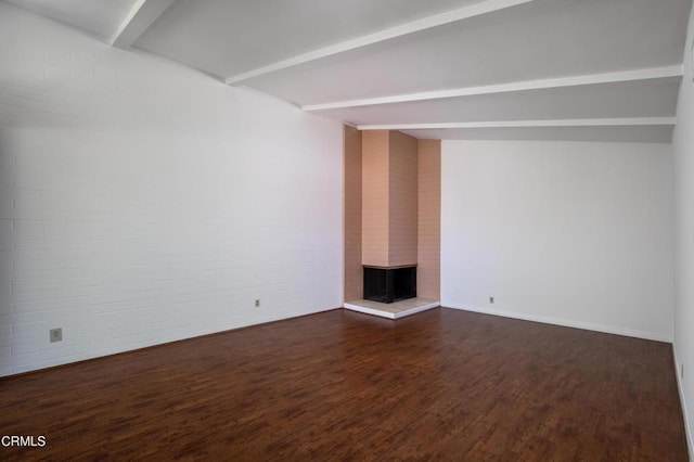 777 E Valley Blvd Unit 142, Alhambra, CA 91801 - unfurnished living room with dark wood-type flooring, a brick fireplace, beam ceiling, and brick wall