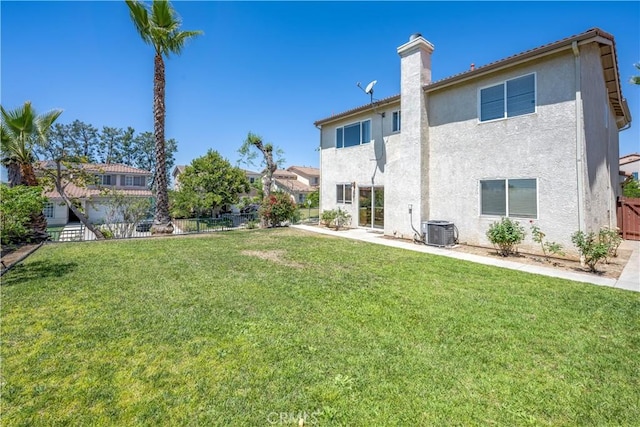 13056 Hagar St, Sylmar, CA 91342 - back of property featuring stucco siding, a fenced backyard, and a chimney