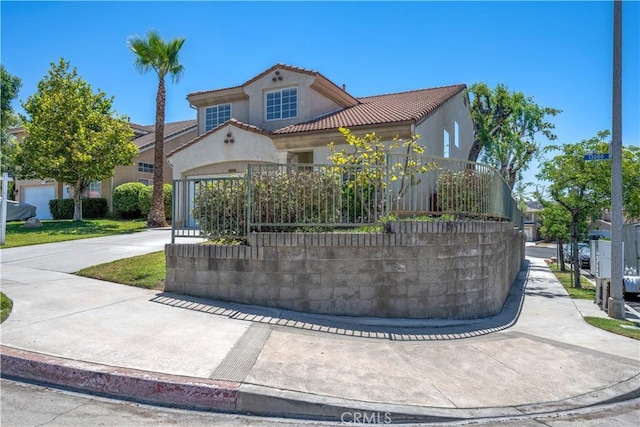 13056 Hagar St, Sylmar, CA 91342 - mediterranean / spanish home featuring a tiled roof, stucco siding, and driveway