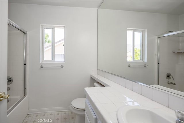 13056 Hagar St, Sylmar, CA 91342 - full bath with plenty of natural light, vanity, shower / bath combination with glass door, and tile patterned floors