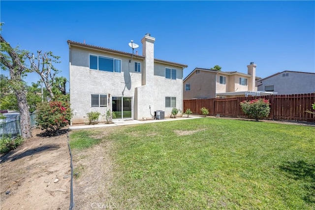 13056 Hagar St, Sylmar, CA 91342 - rear view of house with a fenced backyard, a chimney, stucco siding, and a patio