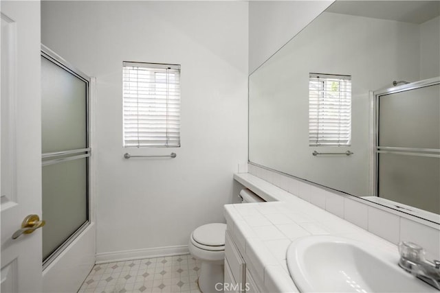 13056 Hagar St, Sylmar, CA 91342 - full bath with tile patterned floors, vanity, and shower / bath combination with glass door
