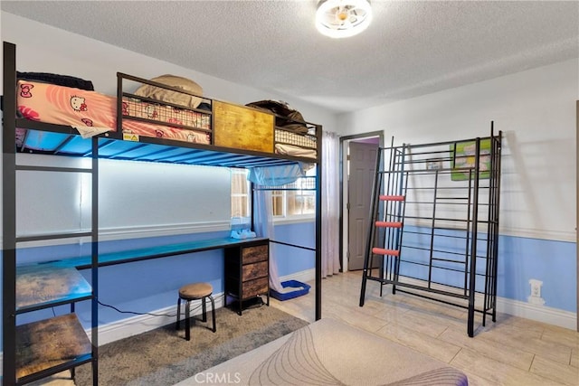 13144 Algonquin Rd, Apple Valley, CA 92308 - bedroom with a textured ceiling and wood finished floors