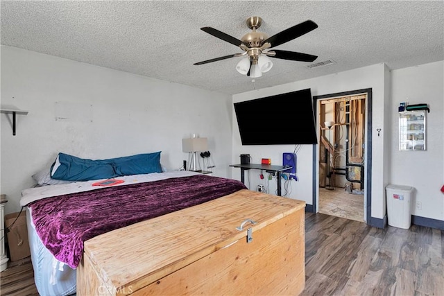 13144 Algonquin Rd, Apple Valley, CA 92308 - bedroom with wood finished floors, a textured ceiling, and ceiling fan