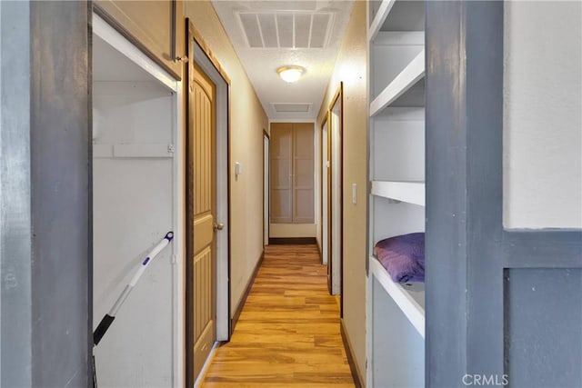 13144 Algonquin Rd, Apple Valley, CA 92308 - hallway featuring light wood-style floors