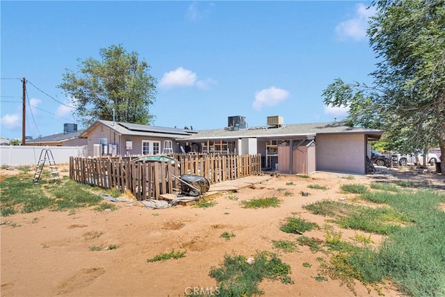 13144 Algonquin Rd, Apple Valley, CA 92308 - rear view of house with solar panels and an attached garage