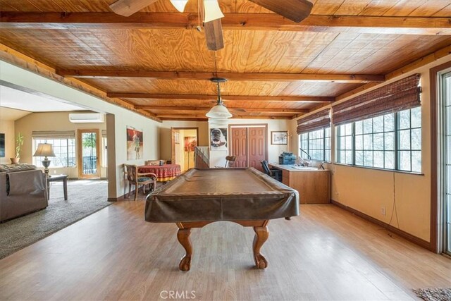 60810 Sunrise Rd, Whitewater, CA 92282 - rec room with a wooden ceiling with exposed beams, healthy amount of natural light, an AC wall unit, and light wood-type flooring