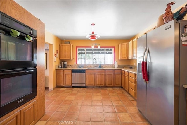 60810 Sunrise Rd, Whitewater, CA 92282 - kitchen with appliances with stainless steel finishes, light countertops, and hanging light fixtures