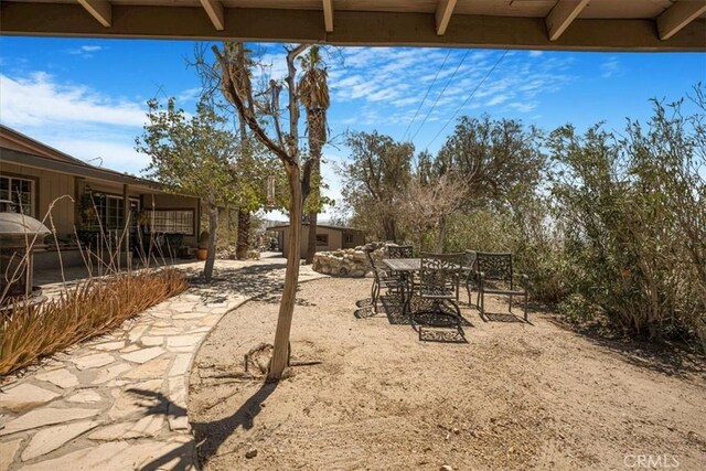 60810 Sunrise Rd, Whitewater, CA 92282 - view of yard featuring outdoor dining area and a patio