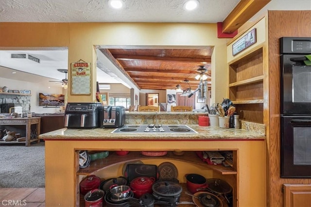 60810 Sunrise Rd, Whitewater, CA 92282 - kitchen featuring ceiling fan, electric cooktop, open shelves, carpet floors, and a textured ceiling