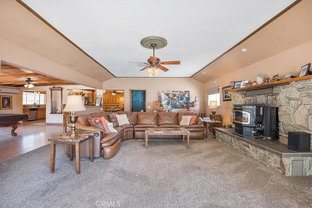 60810 Sunrise Rd, Whitewater, CA 92282 - living area with a ceiling fan, carpet, lofted ceiling, a wood stove, and a wall unit AC