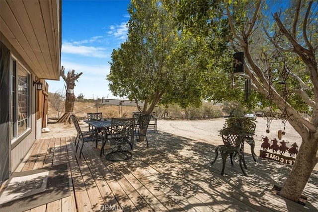 60810 Sunrise Rd, Whitewater, CA 92282 - view of patio featuring a wooden deck and outdoor dining space