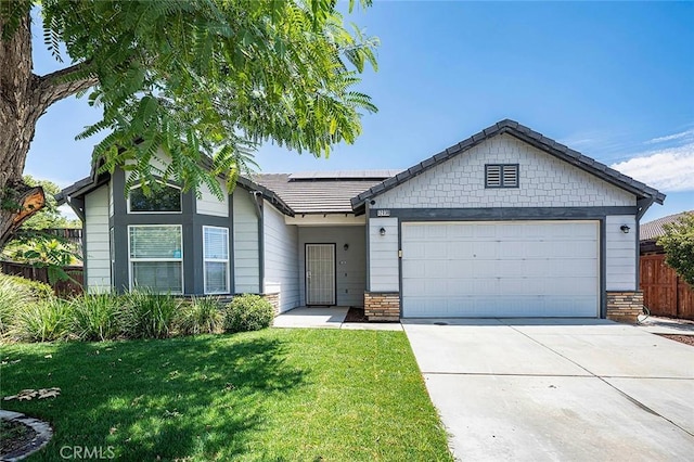 12038 Diego Ct, Moreno Valley, CA 92557 - single story home featuring solar panels, an attached garage, driveway, and stone siding