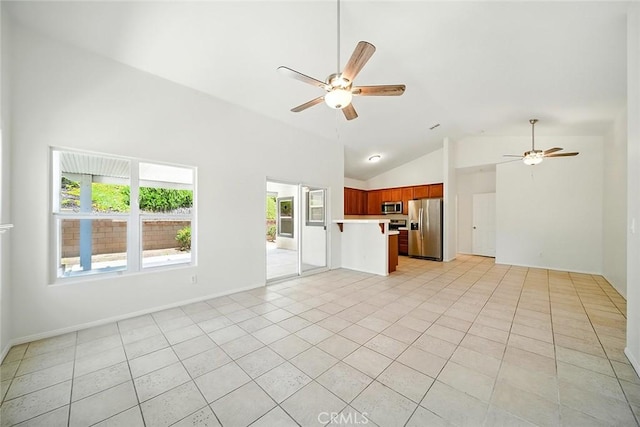 12038 Diego Ct, Moreno Valley, CA 92557 - unfurnished living room featuring ceiling fan, lofted ceiling, and light tile patterned floors
