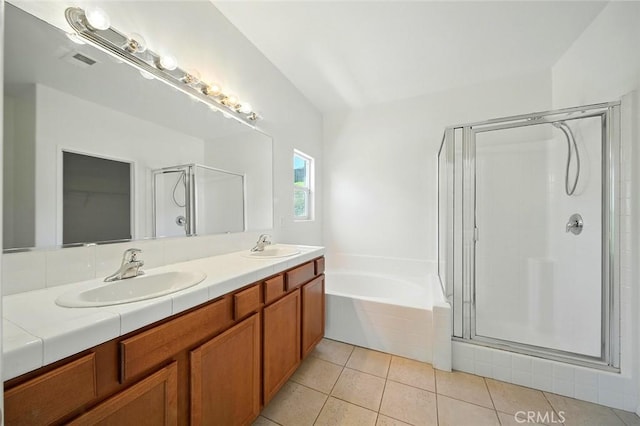 12038 Diego Ct, Moreno Valley, CA 92557 - full bathroom featuring a shower stall, double vanity, a garden tub, and tile patterned floors