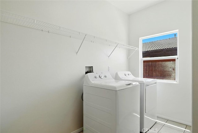 12038 Diego Ct, Moreno Valley, CA 92557 - laundry area featuring washer and clothes dryer and light tile patterned floors