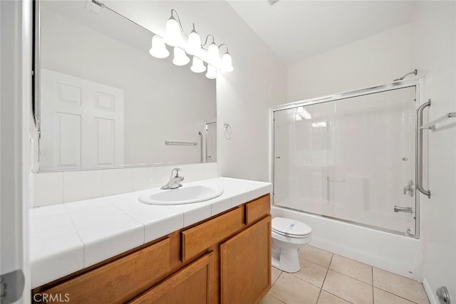 12038 Diego Ct, Moreno Valley, CA 92557 - full bath featuring vanity, tile patterned floors, and bath / shower combo with glass door