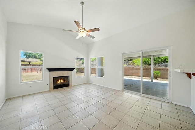 12038 Diego Ct, Moreno Valley, CA 92557 - unfurnished living room featuring light tile patterned floors, a ceiling fan, a tile fireplace, and high vaulted ceiling