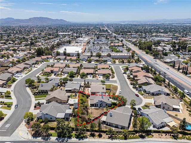 12038 Diego Ct, Moreno Valley, CA 92557 - aerial perspective of suburban area featuring property parcel outlined and a mountain backdrop