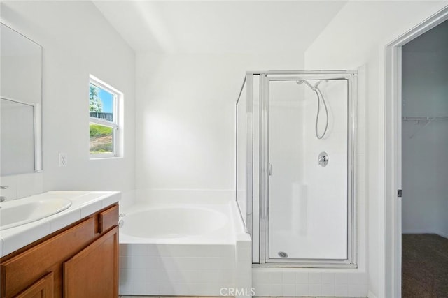 12038 Diego Ct, Moreno Valley, CA 92557 - full bathroom featuring a stall shower, vanity, a garden tub, and a spacious closet